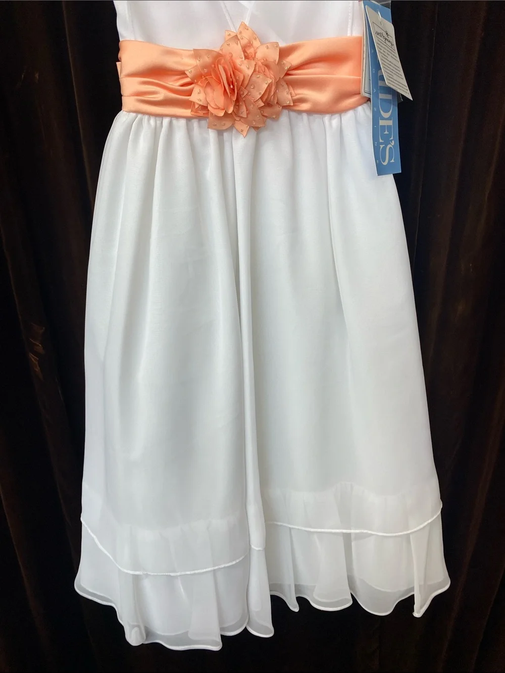 White Girls' Sleeveless Dress with Coral Sash and Floral Accent
